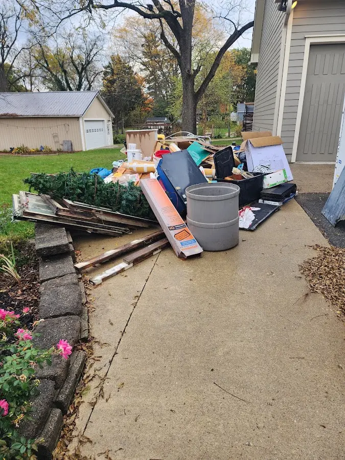 Dumpster being loaded with debris for Residential Dumpster Rental in Solvay
